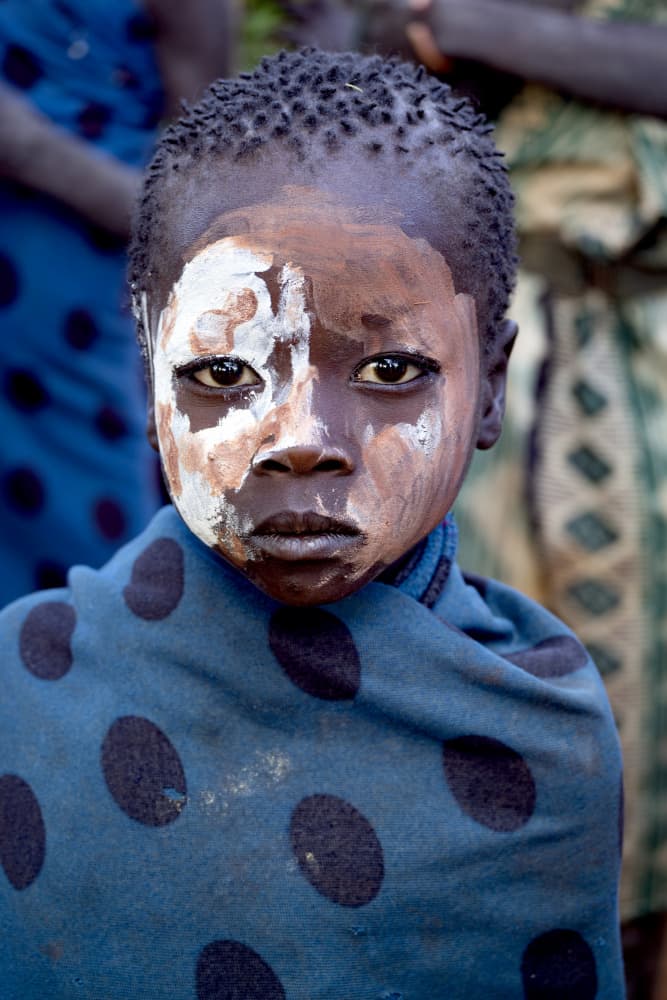 Solemn Painted Face by Iris Wiener — canvas wall art