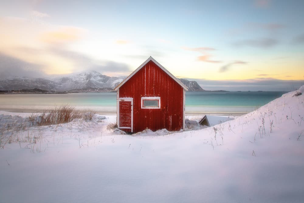 Red Cabin Winter Beach by Martin Steeb — canvas wall art