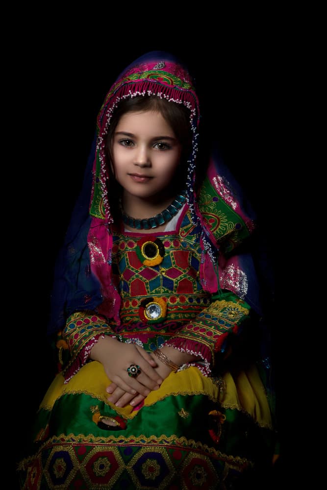 Vibrant Afghan Child by Nikki Georgieva V E G A N I K — canvas wall art