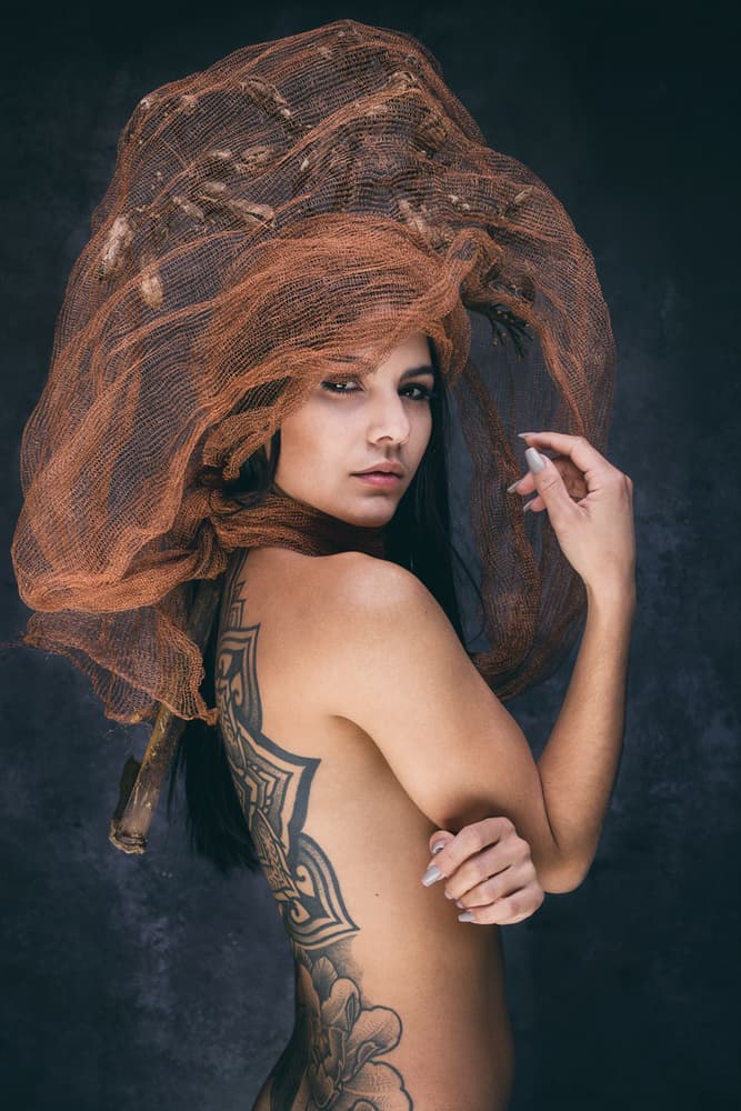 Woman with Artistic Headpiece by Joan Gil Raga — canvas wall art