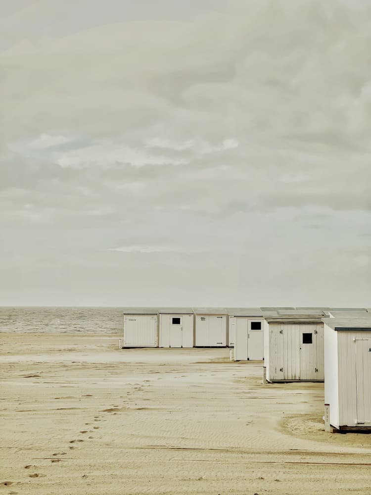 White Beach Huts by Tom Deleenheer — canvas wall art