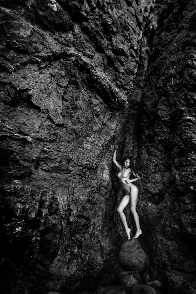 Nude Woman Dark Rocks by Joan Gil Raga — canvas wall art