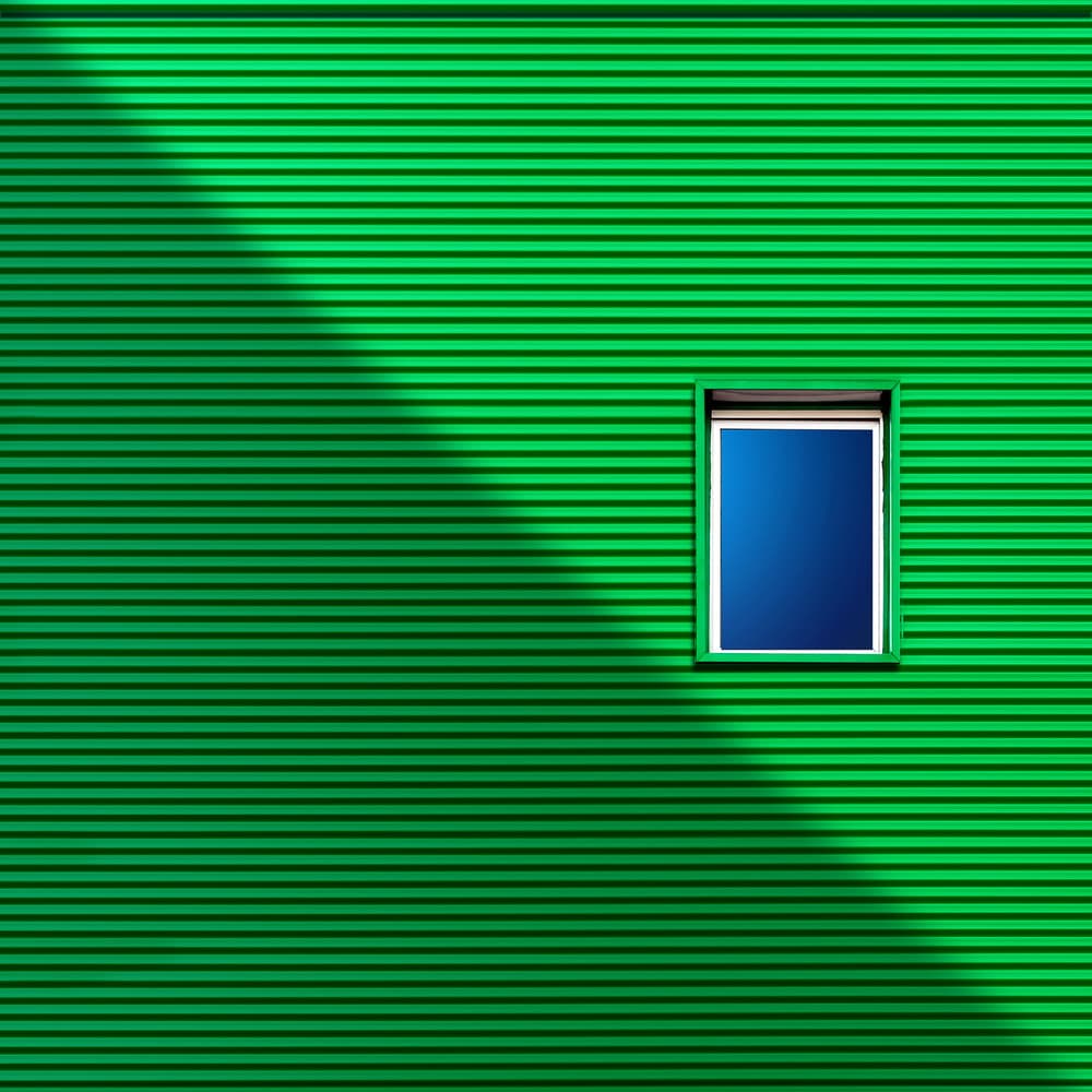 Green Wall Blue Window by Alfonso Novillo — canvas wall art