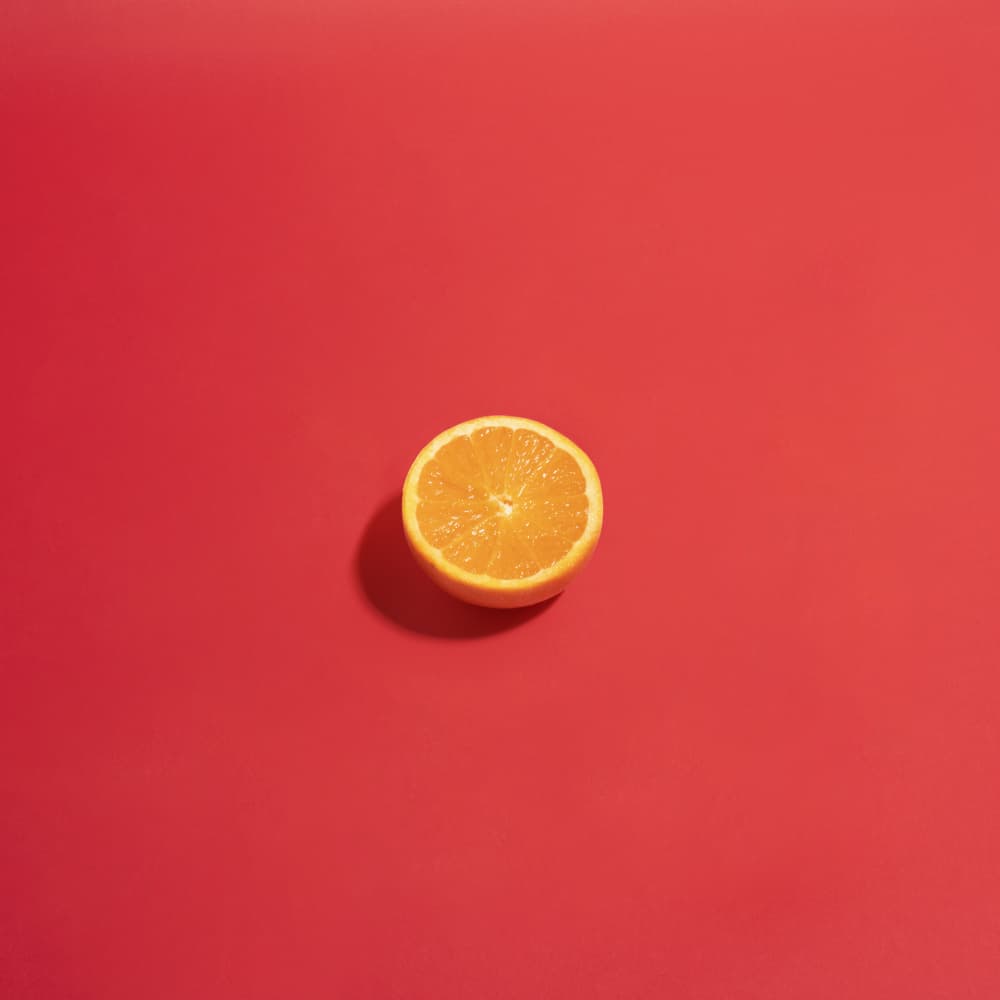 Vibrant Half Orange by Julia Ramiro — canvas wall art