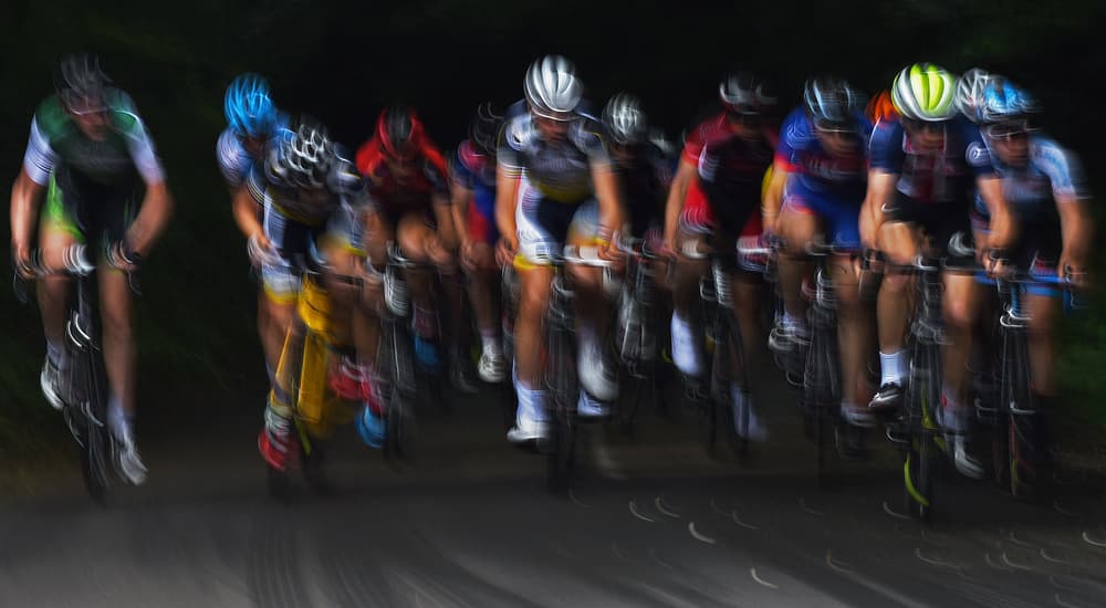 Racing Cyclists Blur by Lou Urlings — canvas wall art