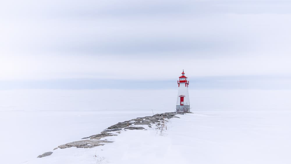 Solitary Winter Lighthouse by Louie Luo — canvas wall art