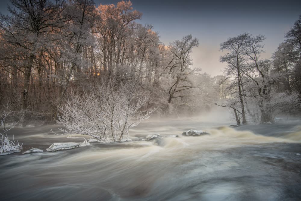 Misty Winter River Flow by Benny Pettersson — canvas wall art