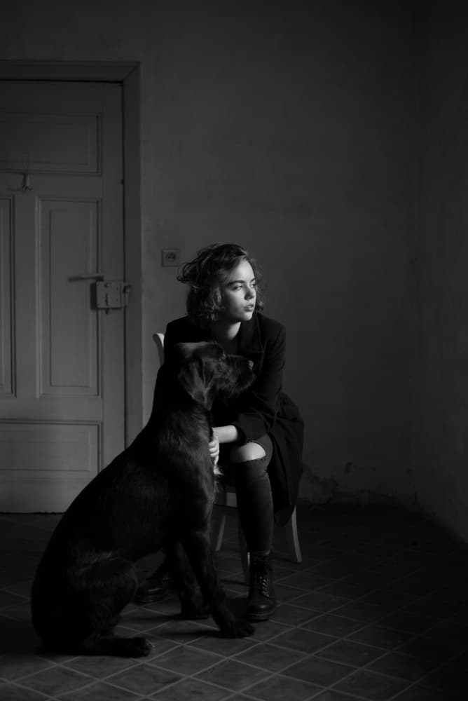 Thoughtful Woman Black Dog by Małgorzata Masarz — canvas wall art