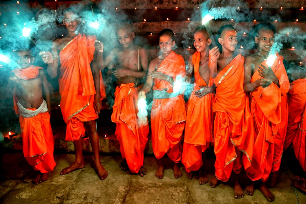 Young Monks Sparkler Celebration by Shaibal Nandi — canvas wall art