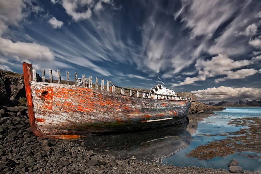 Abandoned Boat Reflections by Þorsteinn H. Ingibergsson — canvas wall art