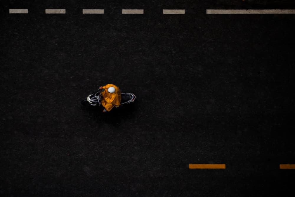Overhead Orange Cyclist by Dzintra Zvagina — canvas wall art