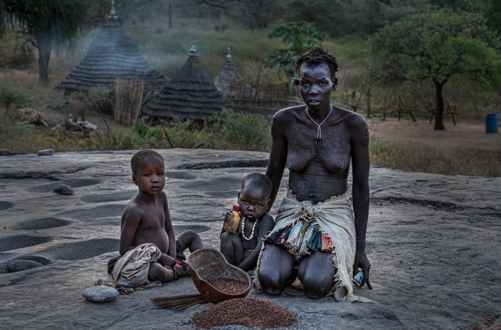 African Village Family by Joxe Inazio Kuesta Garmendia — canvas wall art