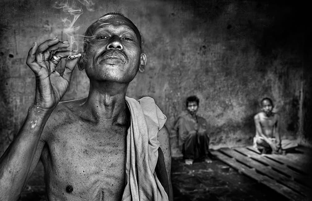 Elder Smoker's Gaze by Sebastian Kisworo — canvas wall art