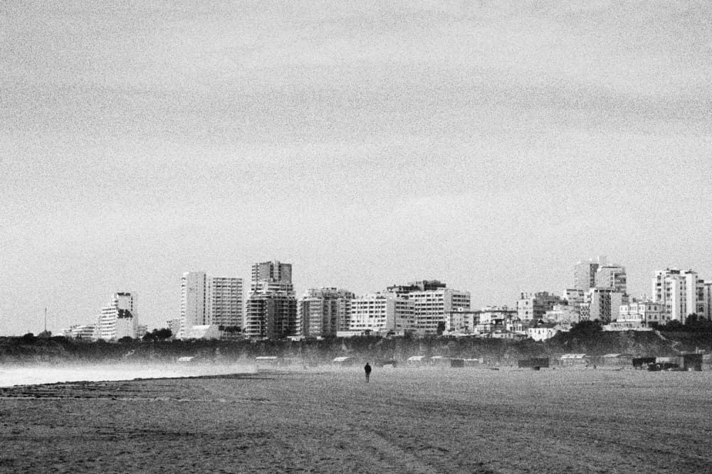 Lone Figure Beach City by Paulo Abrantes — canvas wall art
