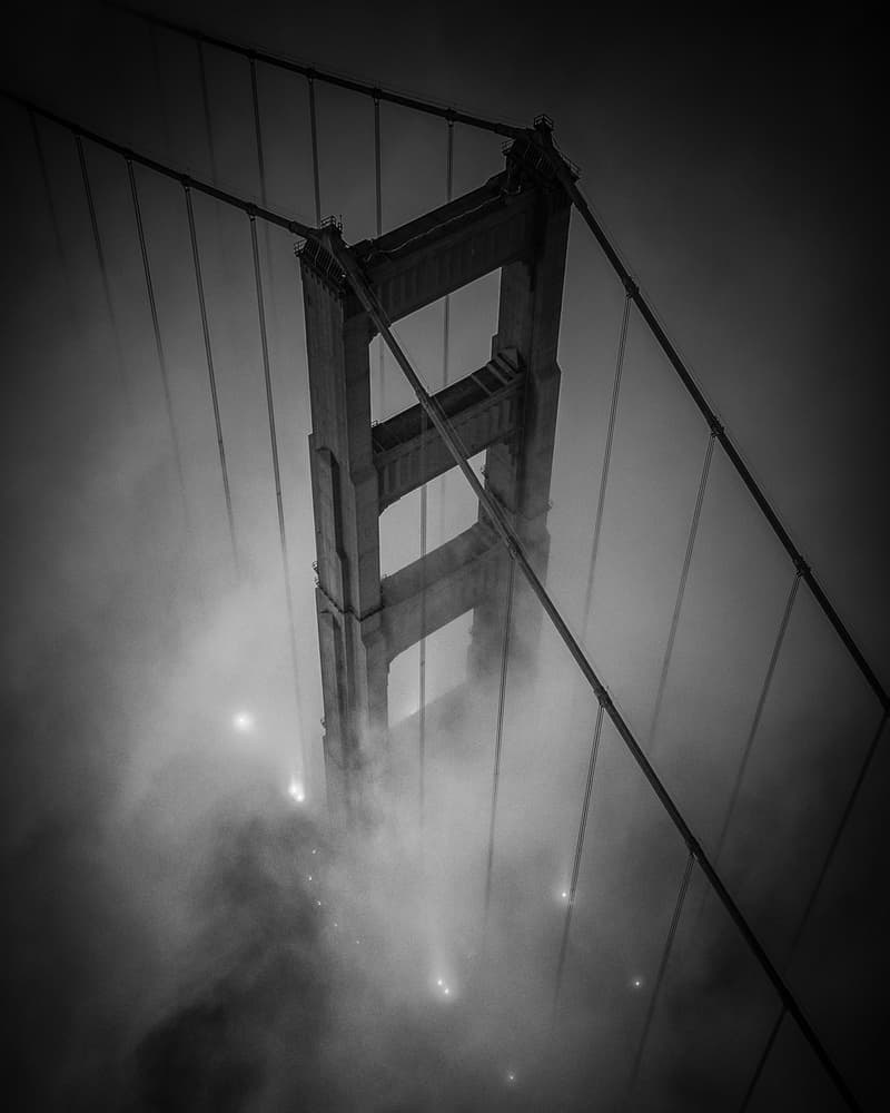 Suspension Bridge in Fog by Toby Harriman — canvas wall art