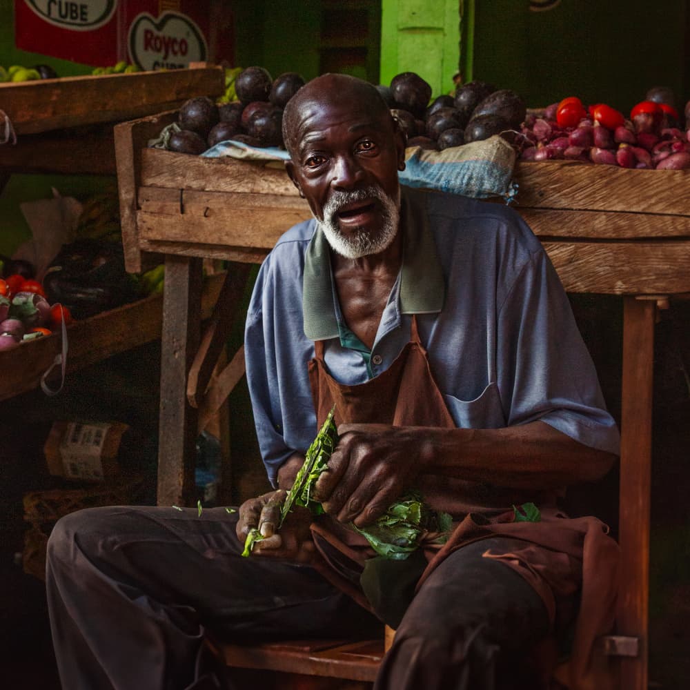 Market Vendor Peeling Greens by Dorian Gray — canvas wall art