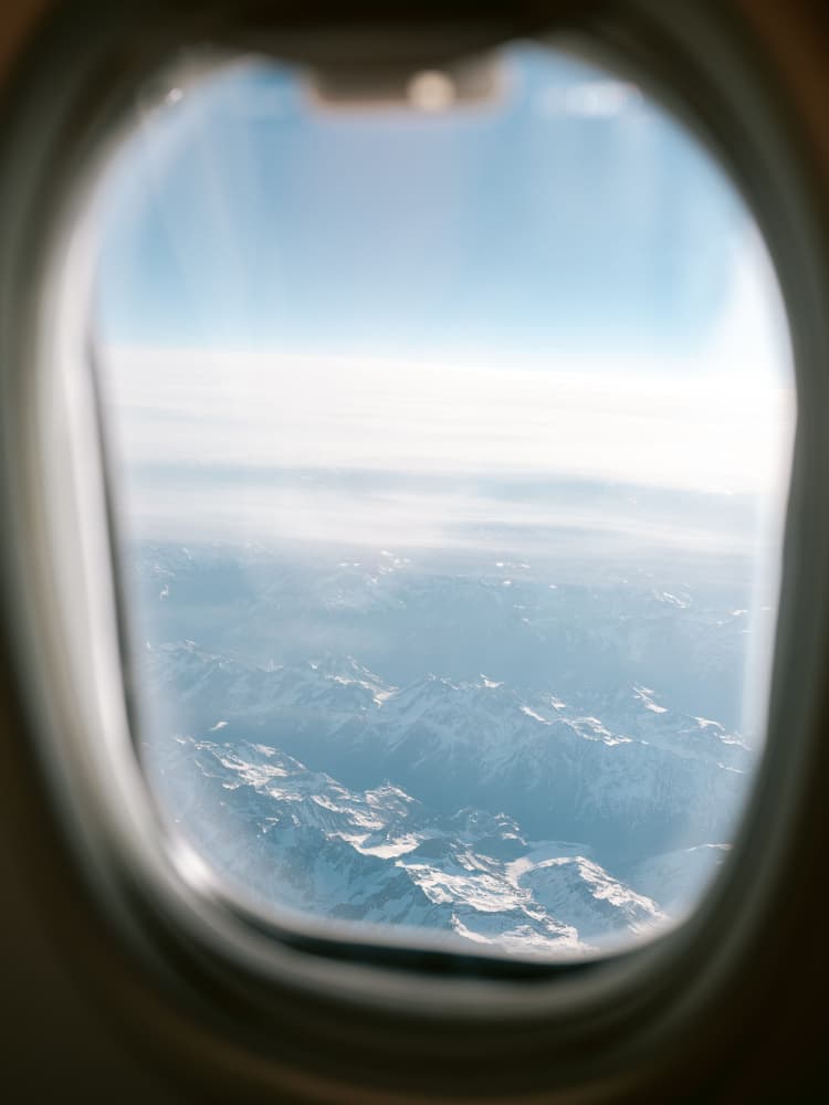 Plane Window View || by Raisa Zwart — canvas wall art