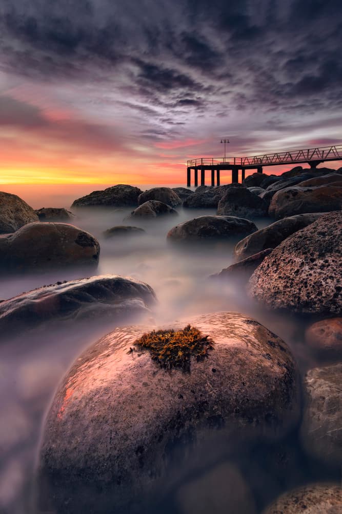 Dramatic Coastal Sunset Rocks by Anto Camacho — canvas wall art