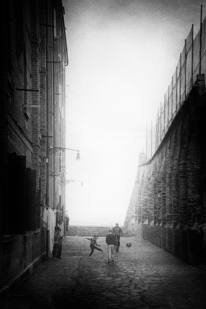 Boys Playing Street Football by Enrico Facchetti — canvas wall art