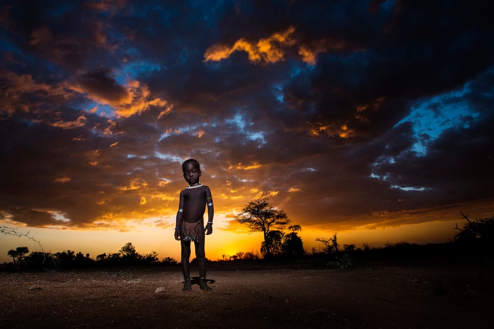 Young Boy Sunset Sky by Goran Jovic — canvas wall art