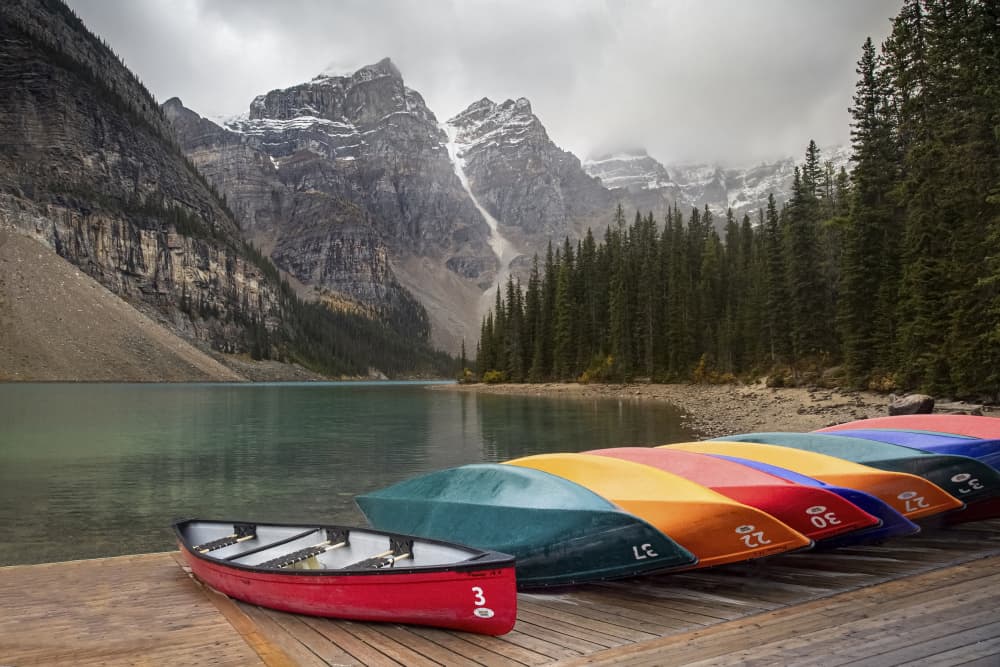 Colorful Canoes Mountain Lake by Roelof de Hoog — canvas wall art