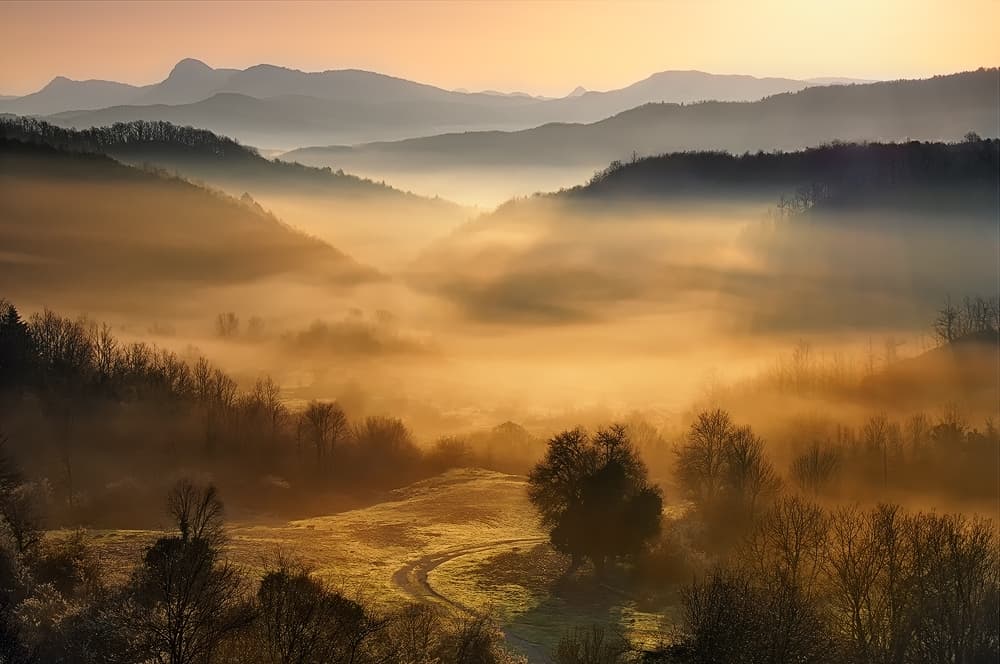 Sunrise Over Misty Valley by Maria Kaimaki — canvas wall art