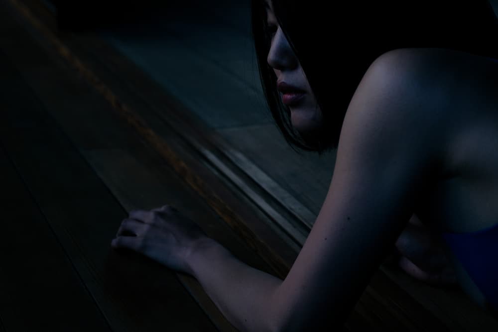 Woman in Dark Contemplation by Takaaki Ishikura — canvas wall art