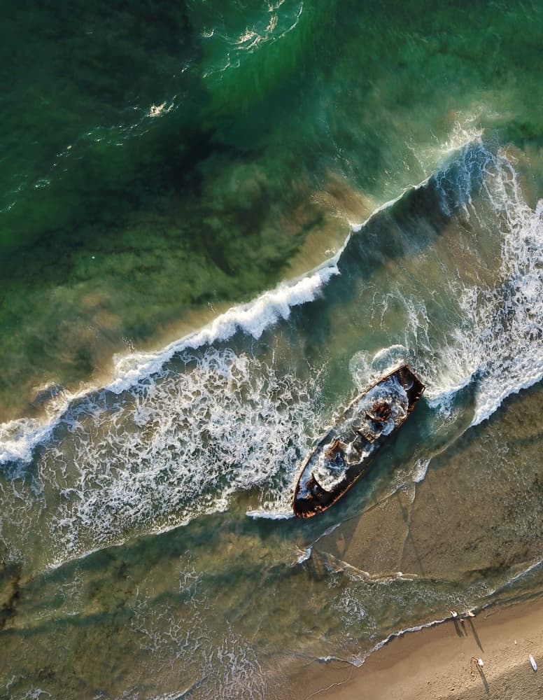 Emerald Ocean Shipwreck by eMunther — canvas wall art