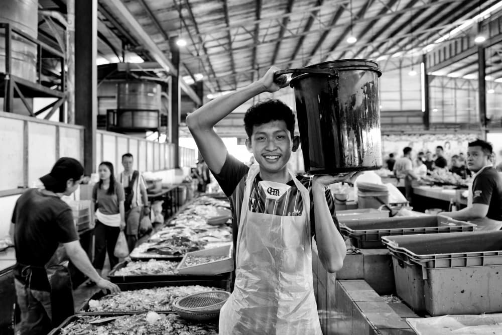 Smiling Market Man by Kieron Long — canvas wall art