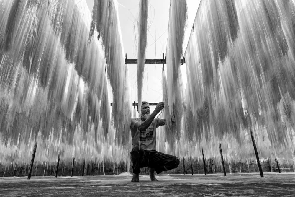 Drying noodles by Azim Khan Ronnie — canvas wall art