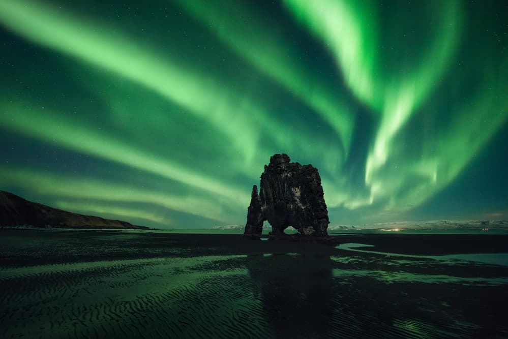 Northern Lights Rock by David Martin Castan — canvas wall art