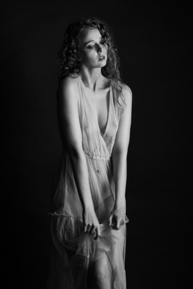 Pensive Woman Sheer Dress by Athos K. Florides — canvas wall art