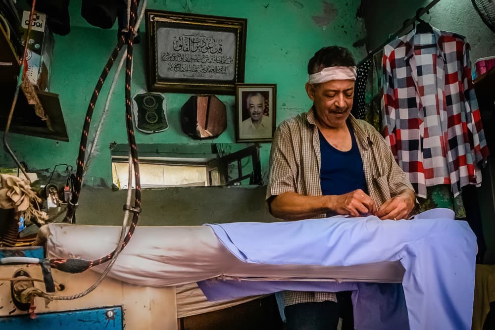 Dedicated Tailor At Work by Hisham Aboelnaga — canvas wall art