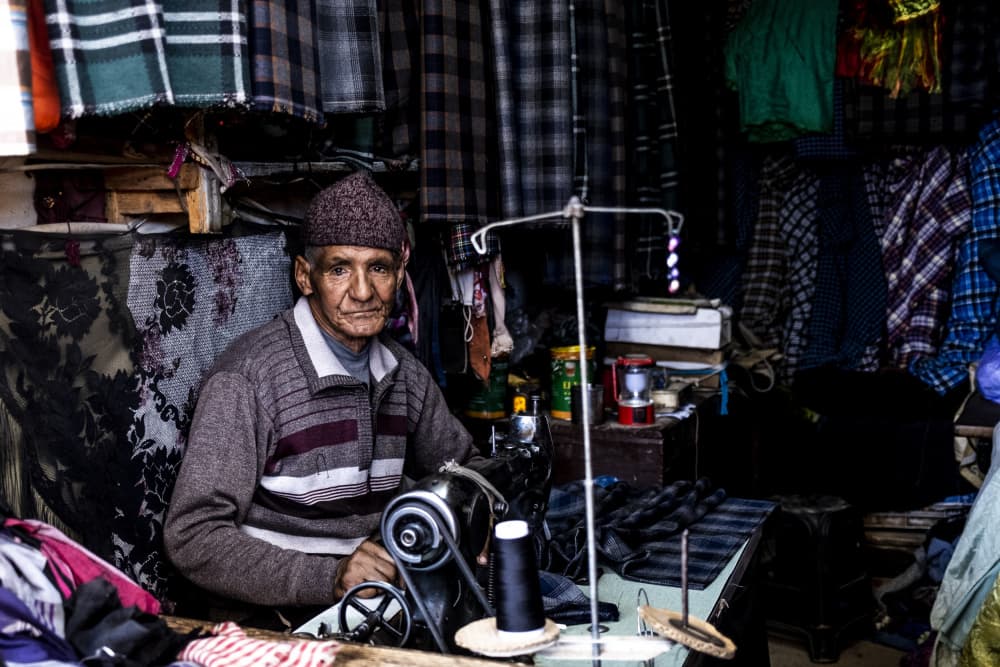 Old Tailor at Work by Eyal Alcalay — canvas wall art