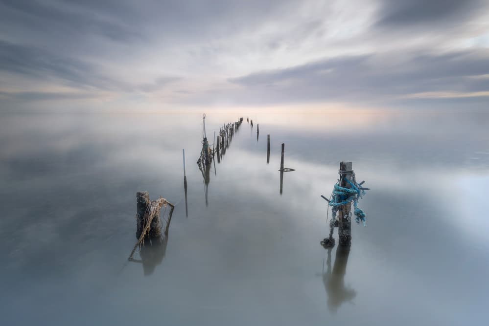 Serene Coastal Poles by Joaquin Guerola — canvas wall art