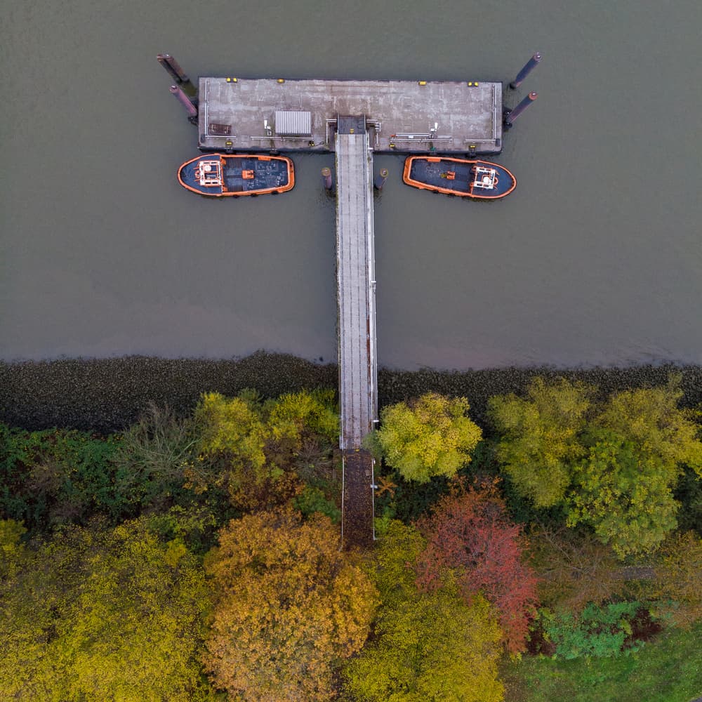 Autumn River Dock Aerial by Marc Pelissier — canvas wall art