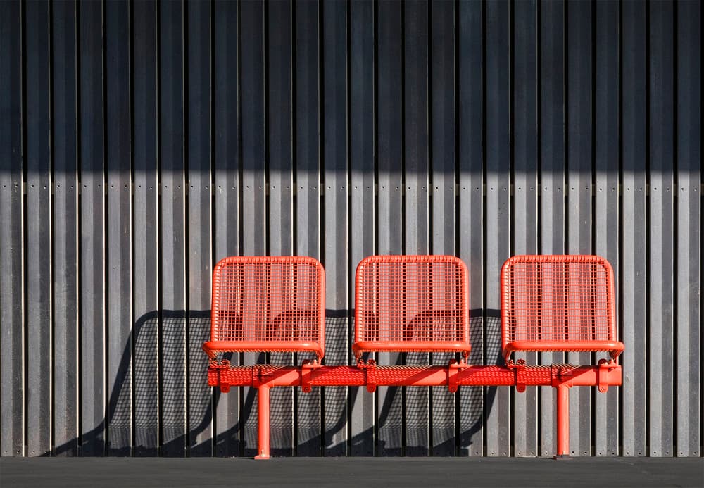 Red Chairs Strong Shadows by Jef Van den Houte — canvas wall art