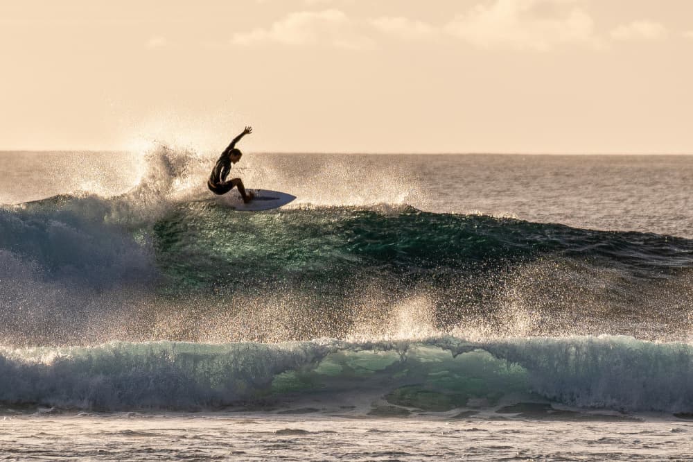 Surfer's Golden Wave by Serge Melesan — canvas wall art