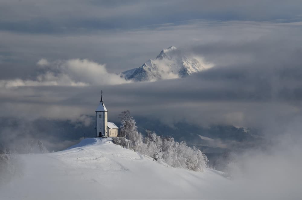 Snowy Mountain Church by Bojan Kolman — canvas wall art
