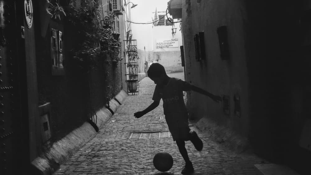 Street Soccer Boy by Markos Tsoukalas — canvas wall art