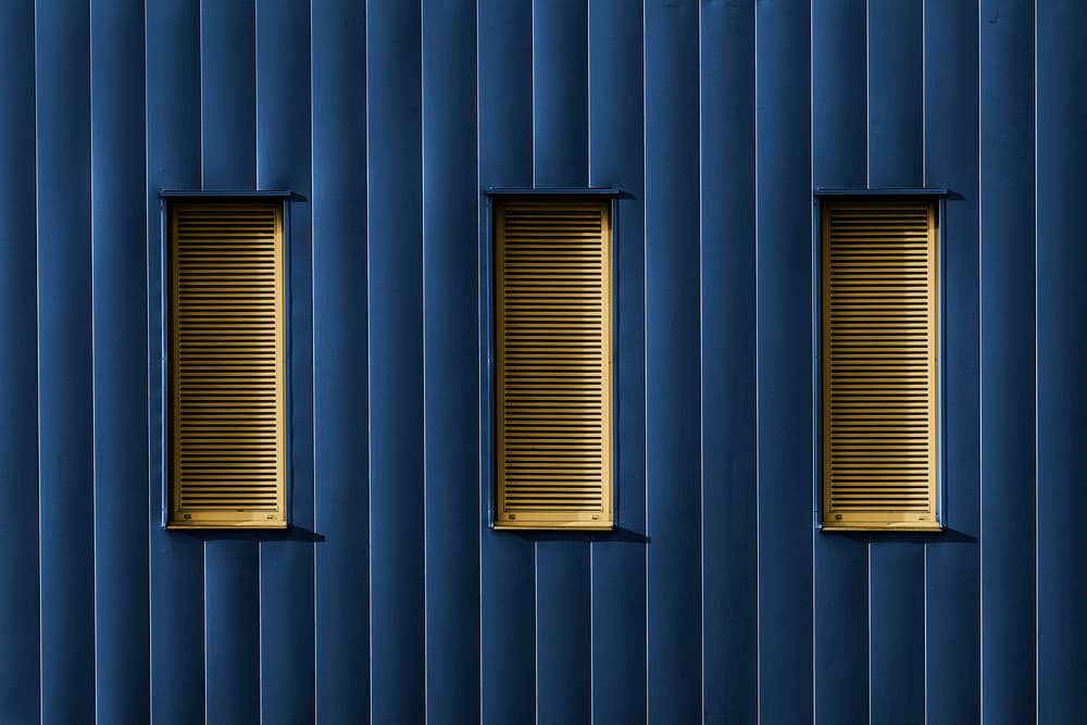 Blue Facade Golden Windows by Jef Van den Houte — canvas wall art