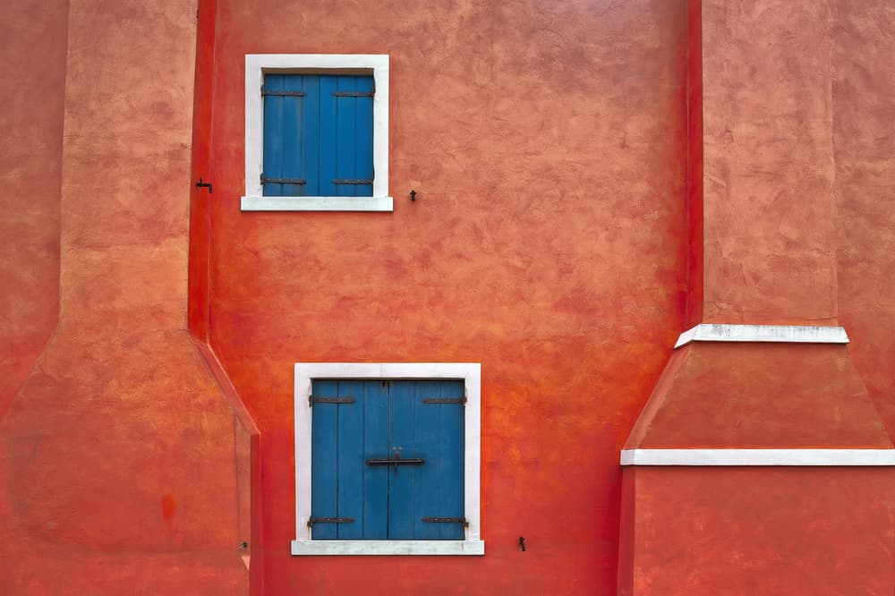 Red Wall Blue Shutters by Fiorenzo Rondi — canvas wall art