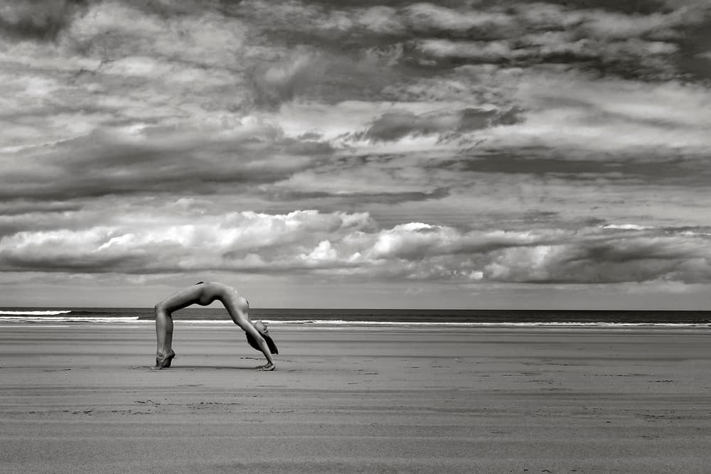 Serene Nude Beach Yoga by Hugh Wilkinson — canvas wall art