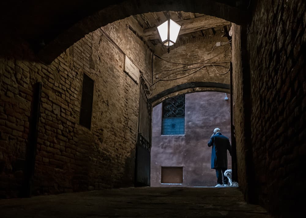 Lone Figure Dark Passage by Luca Domenichi — canvas wall art