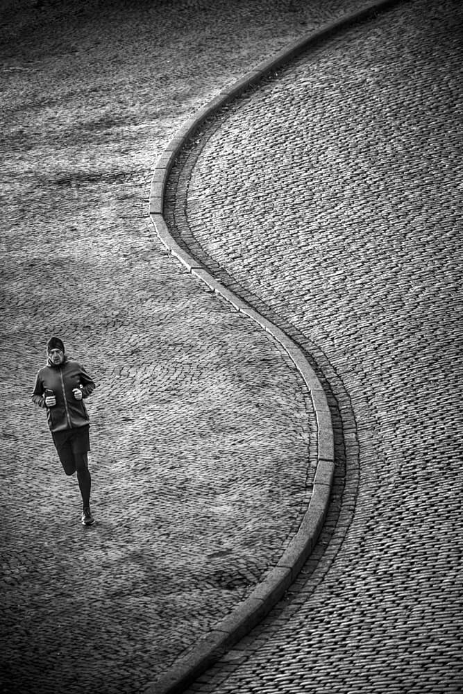 Solitary Runner's Curve by Anna Niemiec — canvas wall art