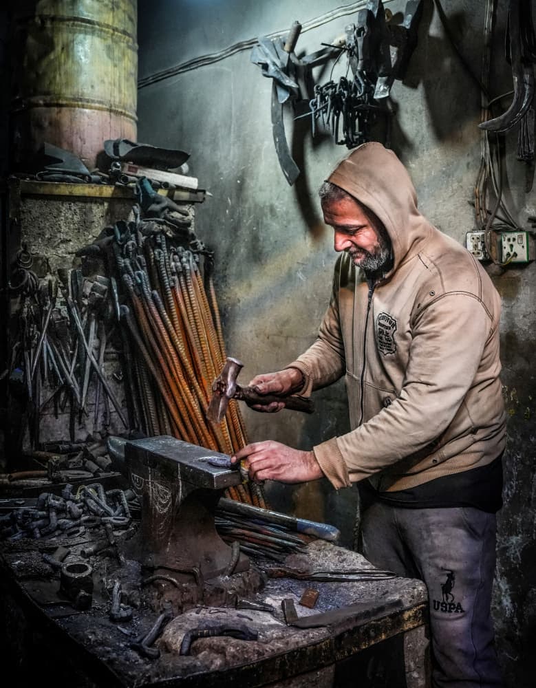 Artisan Forging Metal by Bashar Alsofey — canvas wall art