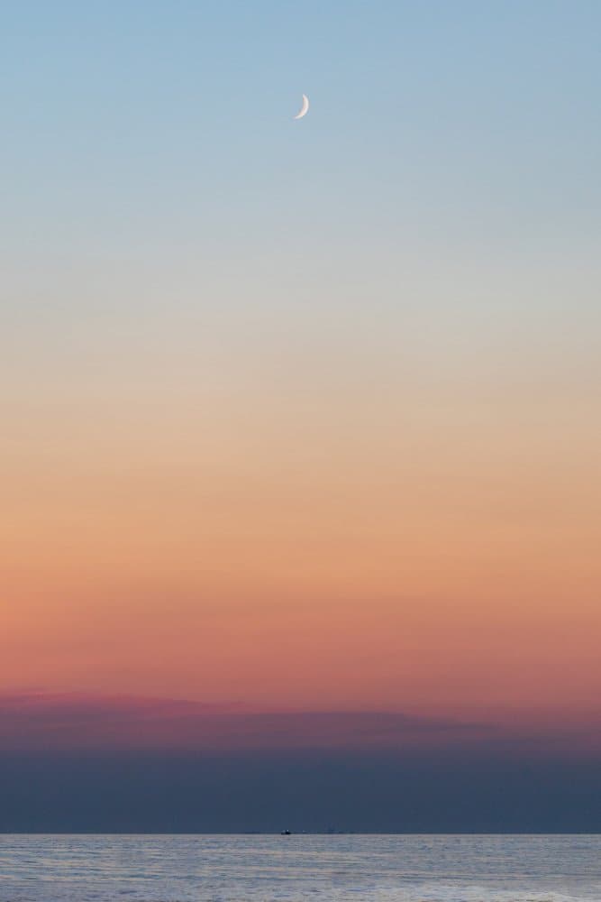 Crescent Moon Ocean Horizon by Jakob Remar — canvas wall art