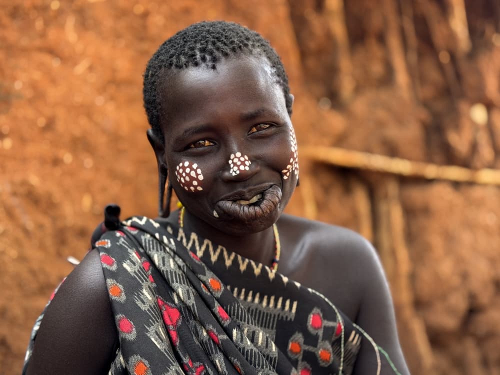 African Woman's Painted Smile by Ilana Lam — canvas wall art