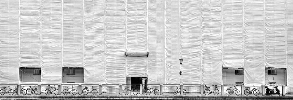 White Facade Bicycles by Hans Peter Rank — canvas wall art