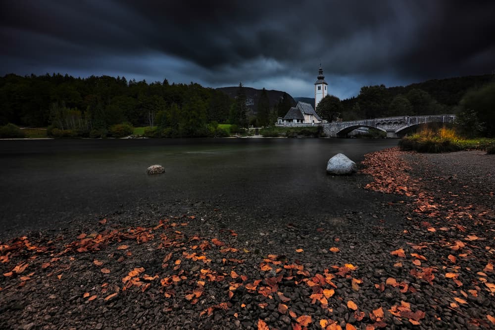 Dark Autumn Church Bridge by Jassi Oberai — canvas wall art